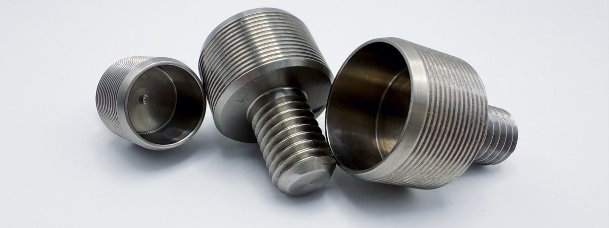 Special screws M10 and M12 made of stainless free-cutting steel 1.4305 (AISI 303), precise CNC multi-spindle turned parts for mechanical engineering and automation technology.